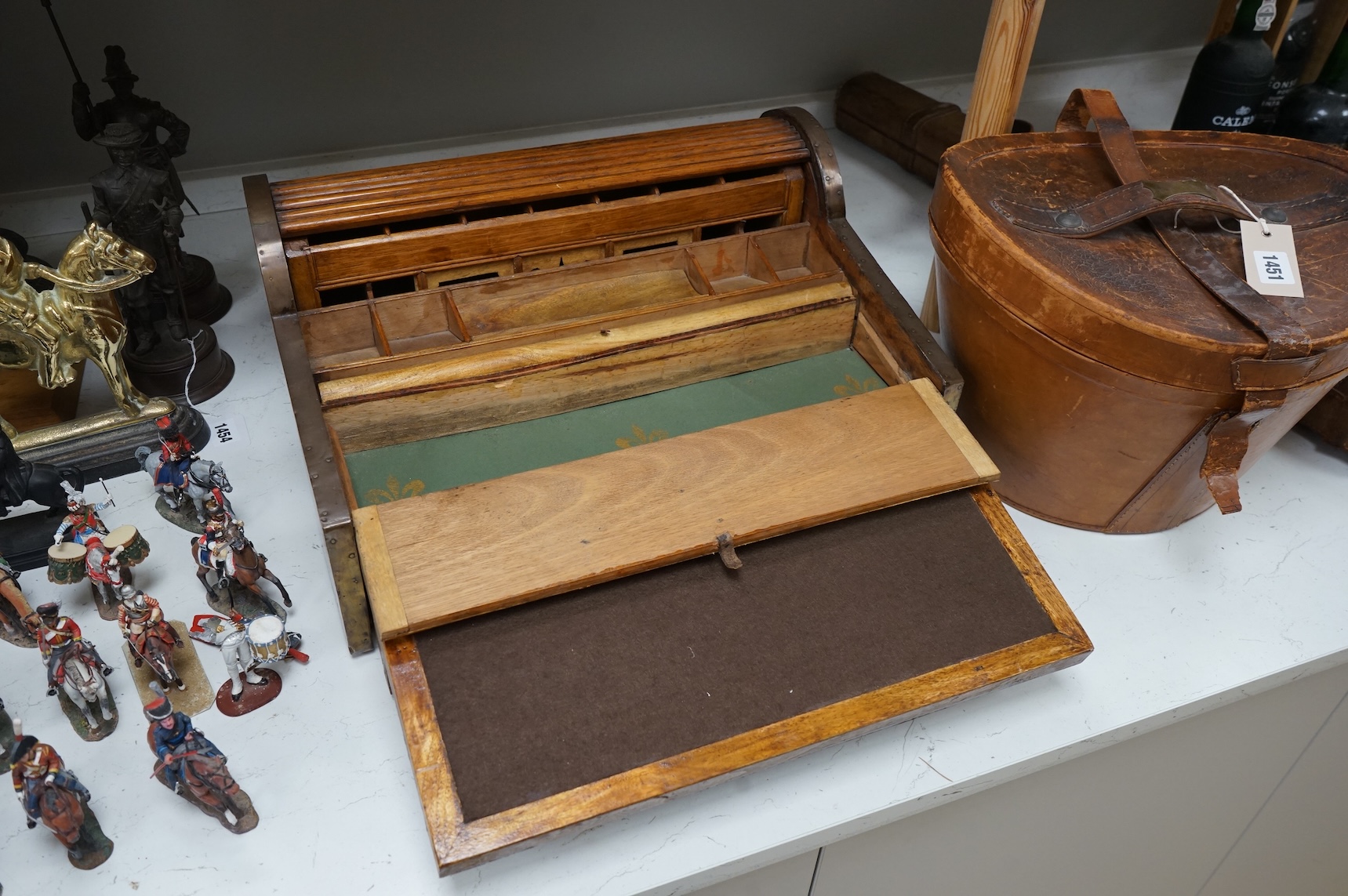 A Victorian Anglo-Indian brass mounted camphor wood campaign roll top writing box, with drawer. 12.5cm high x 35cm deep x 45.5cm wide.